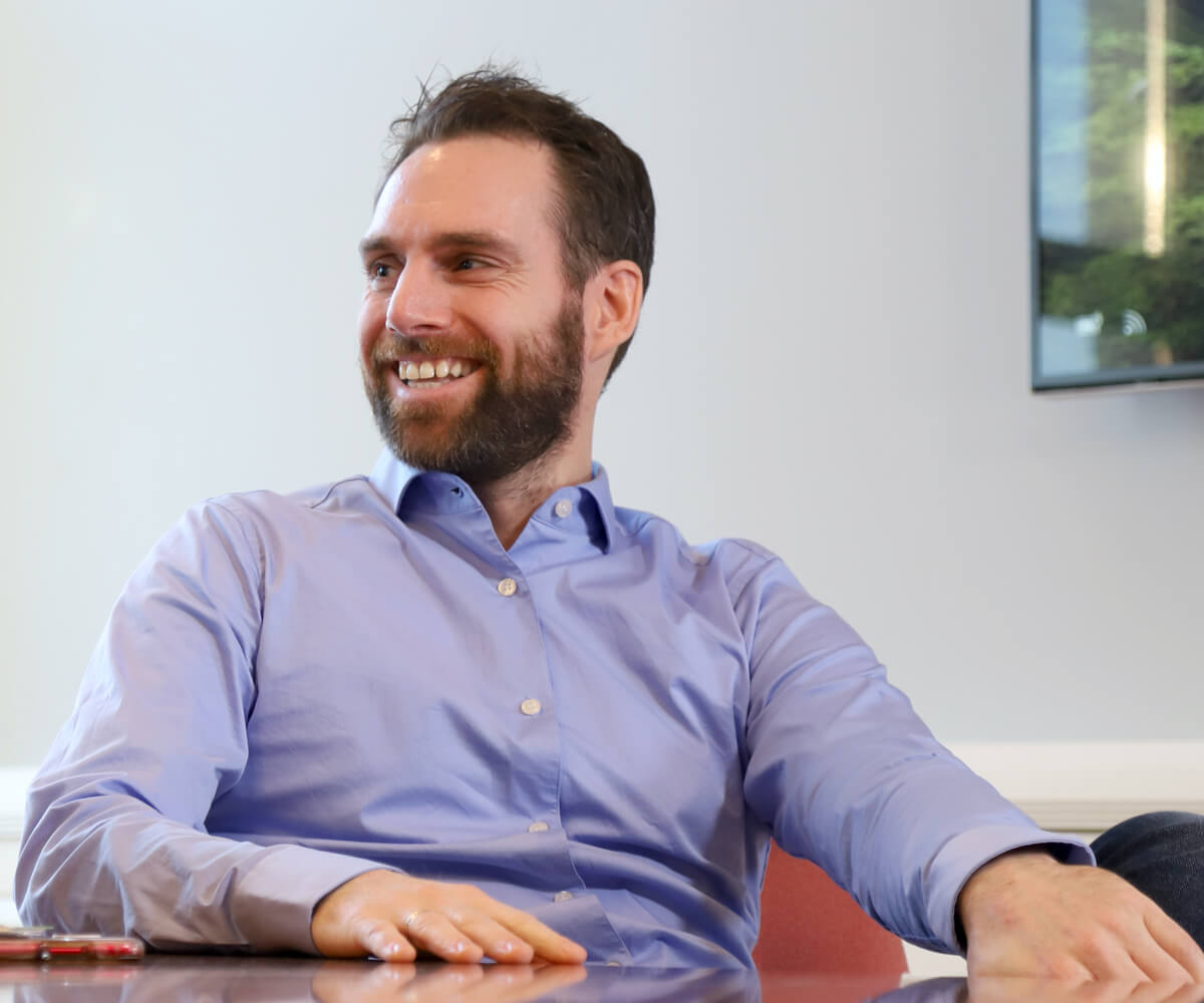 Smiling man in a meeting